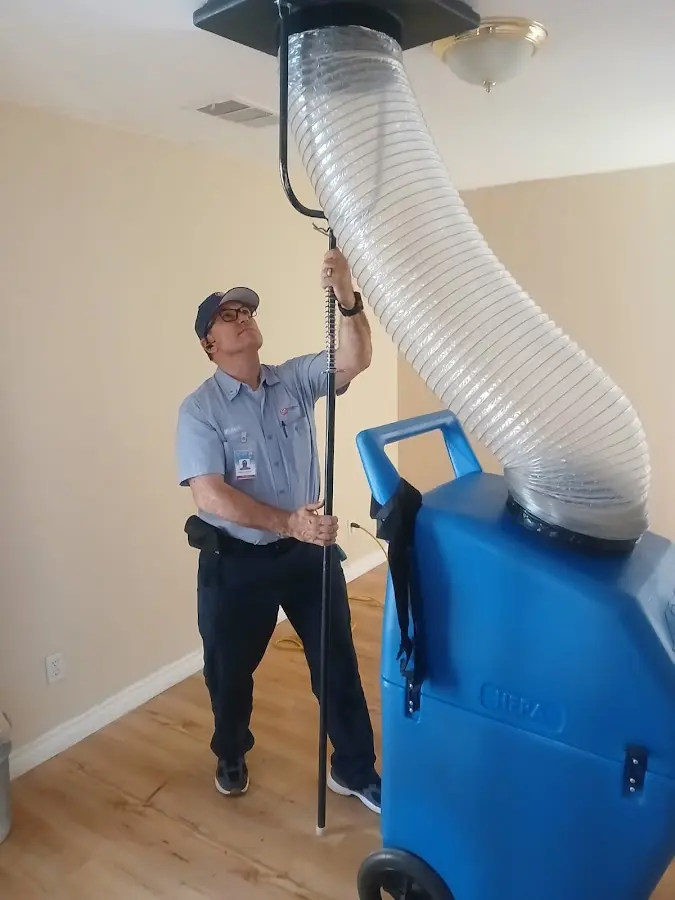 Mini Split Installation technician using HEPA equipment in Coalinga